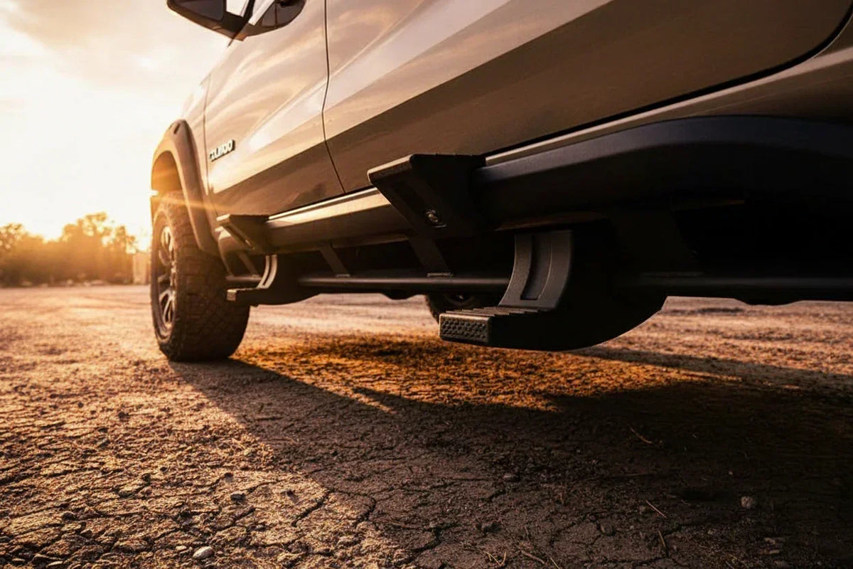 Close-up of snap-on truck sidestep accessory, mounted on off-road vehicle at sunset
